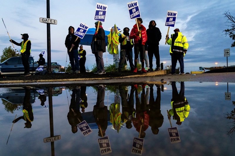 Factory workers form a picket line outside an auto plant in Louisville, Kentucky, on Oct. 14, 2023.