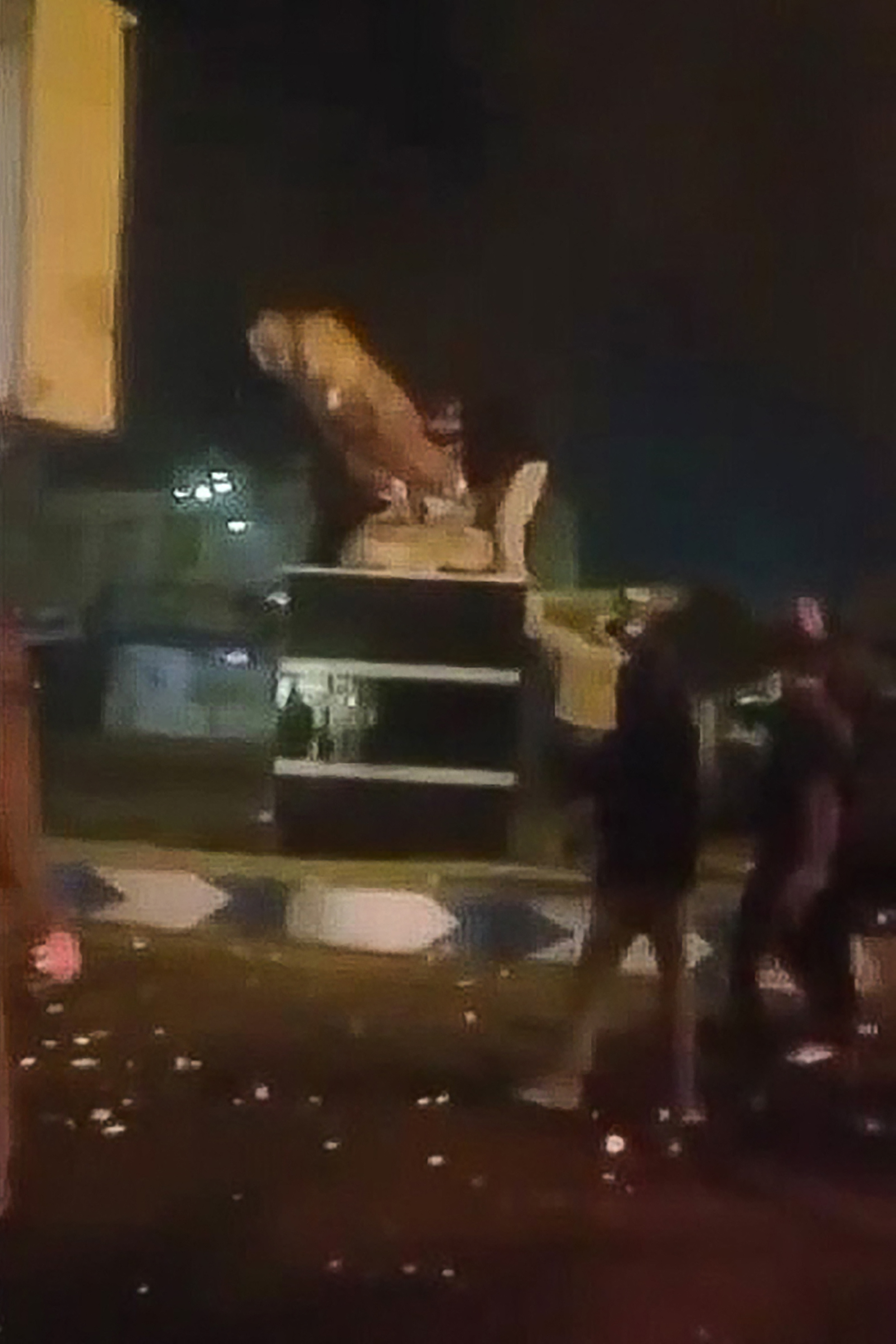 Protesters toppling a statue of Qasem Soleimani in Qamayeh, Iran.