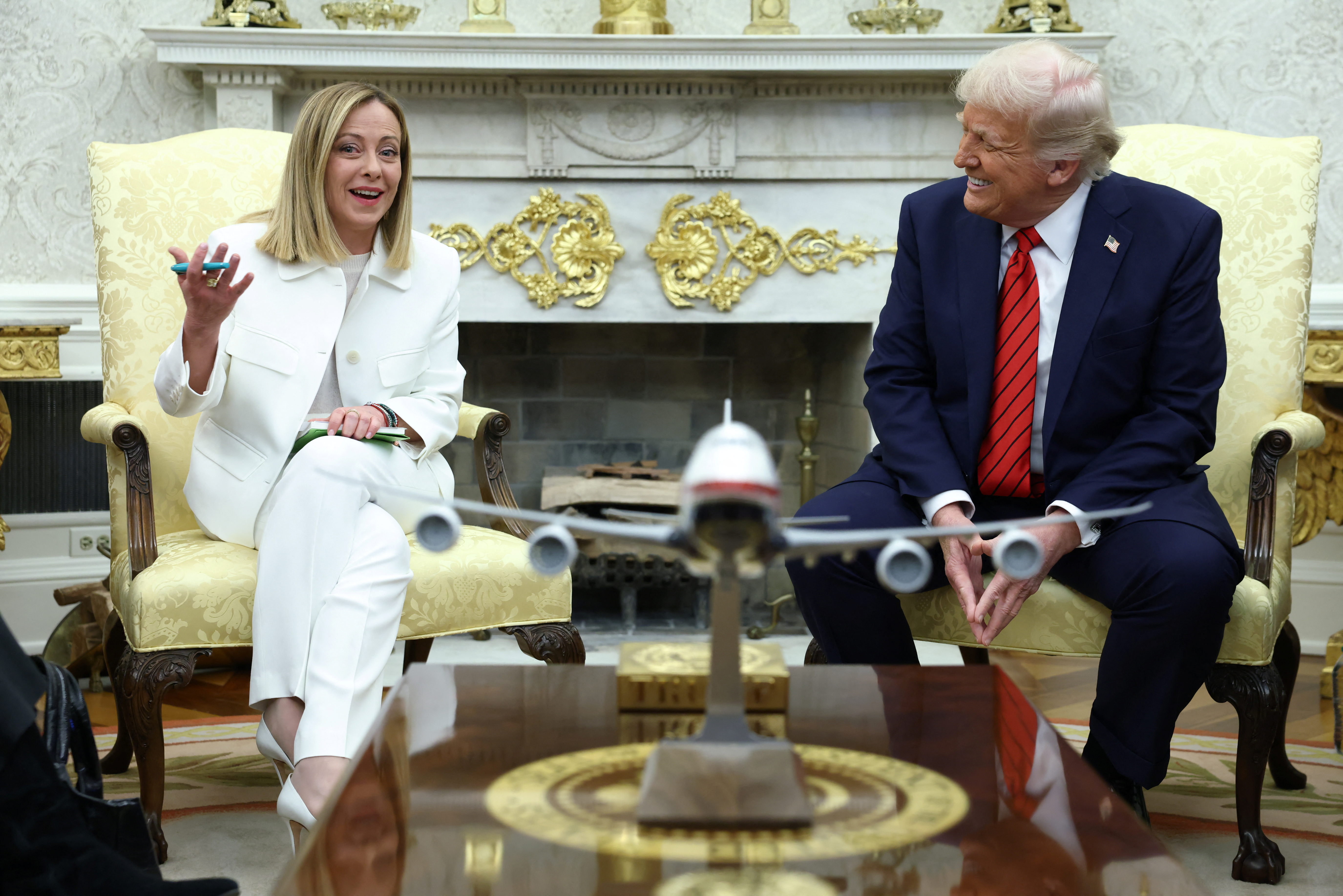 U.S. President Donald Trump meets with Italian Prime Minister Giorgia Meloni in the Oval Office.