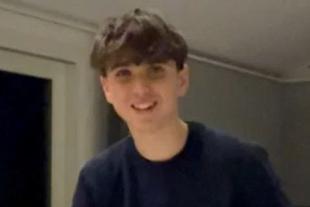 Arthur Brodard, 16, smiling while holding a package.
