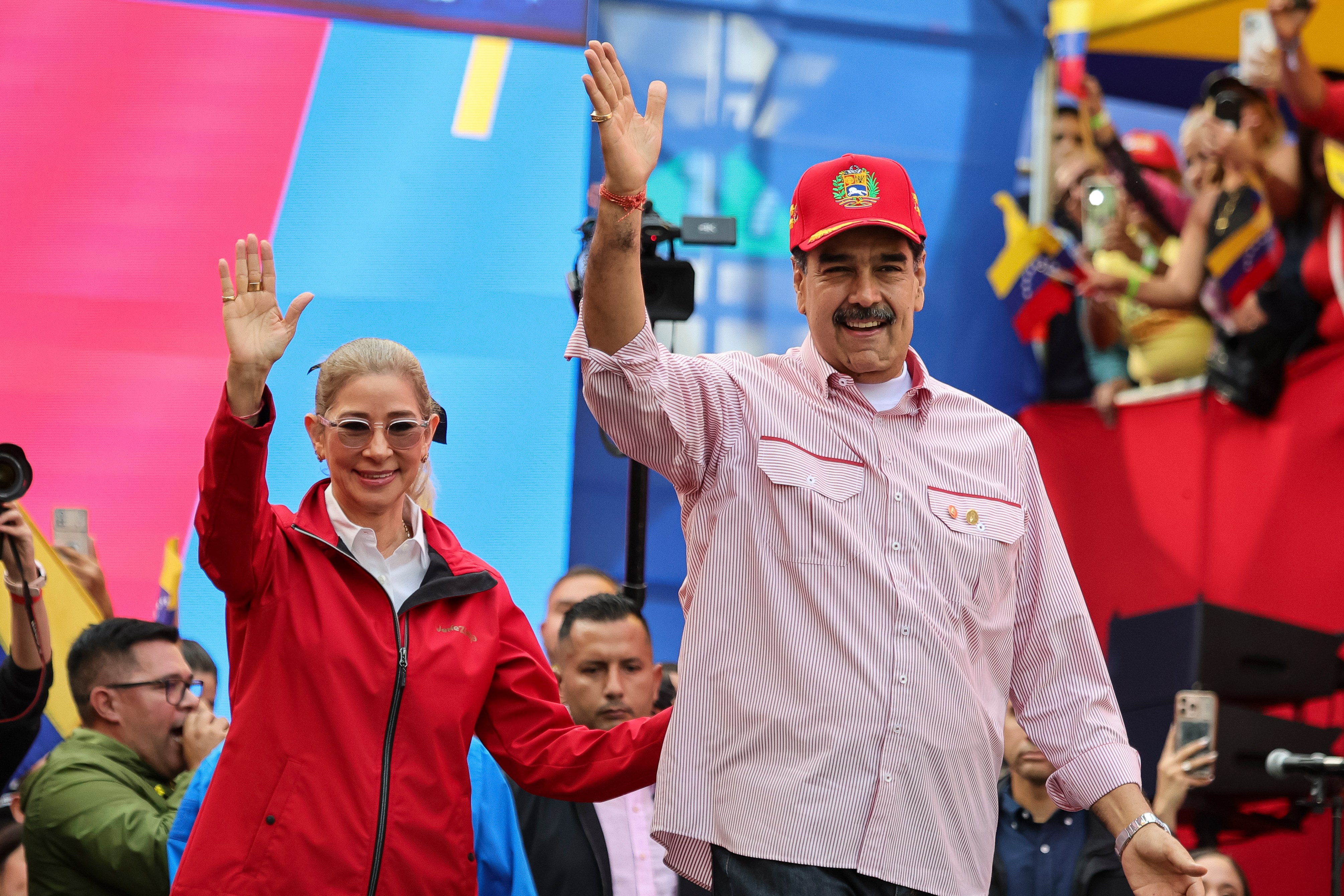 Venezuelan President Nicolas Maduro and his wife Cilia Flores greeting supporters.