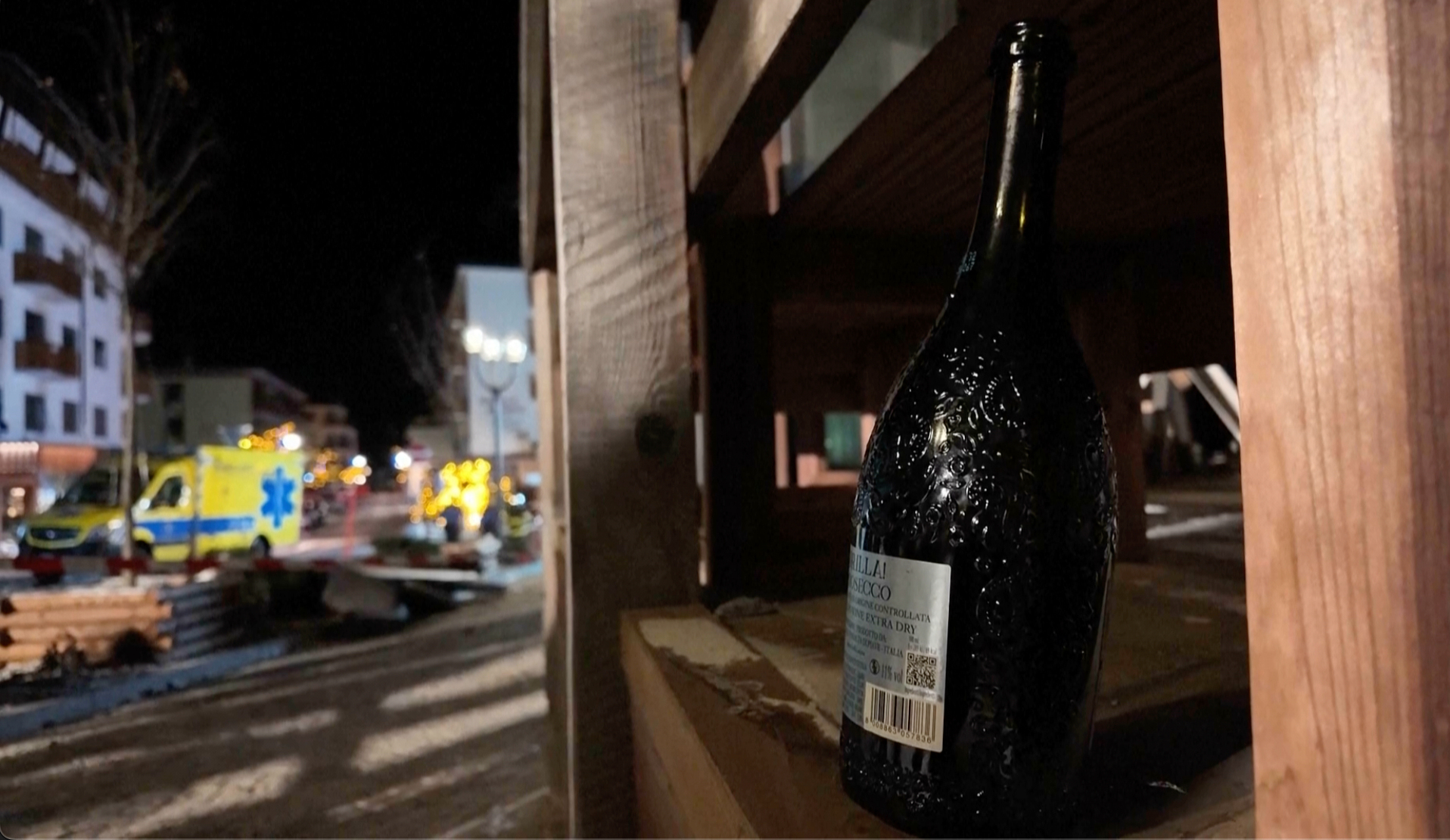 A bottle of sparkling wine lies close to where the fire broke out