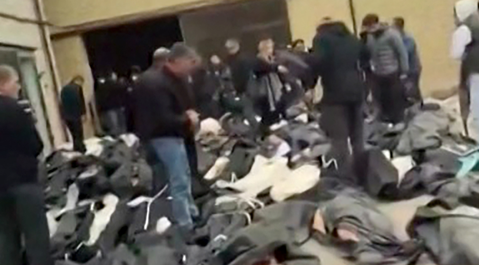 Bodies in body bags laid out in the courtyard of the Forensic Diagnostic and Laboratory Center of Tehran Province.