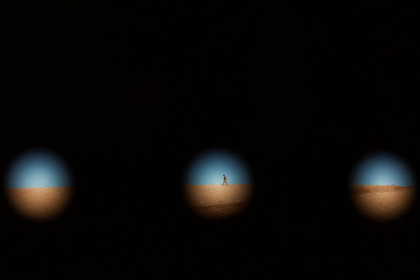 A US Army soldier is seen through a section of the border wall between the United States and Mexico, as seen from Ciudad Juarez, Mexico, on January 14, 2026.