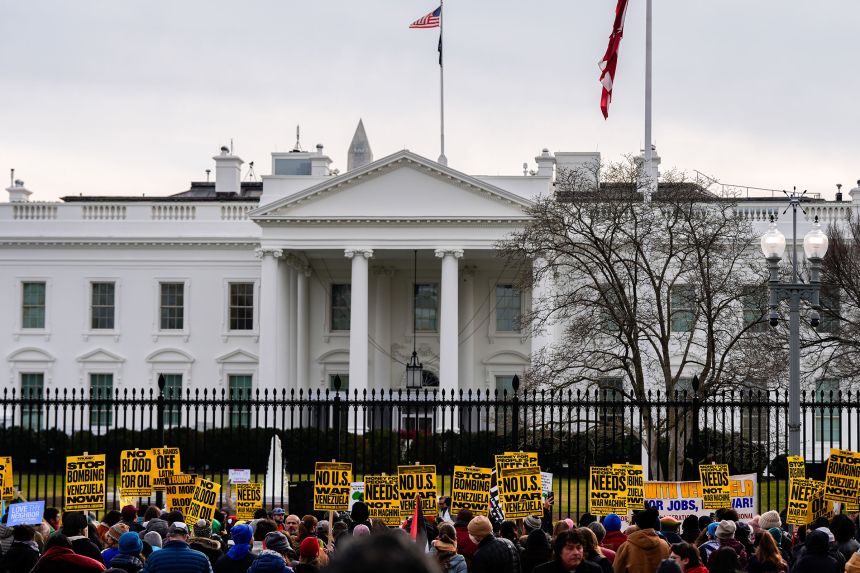 Protesters rally outside the White House on Saturday, after the US captured Maduro and his wife.