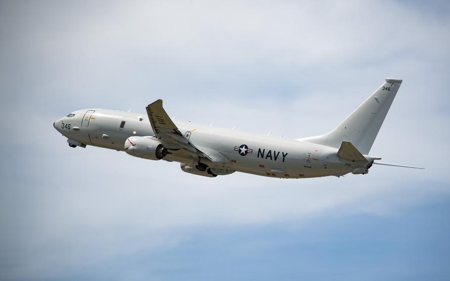 A P-8A aircraft takes off.