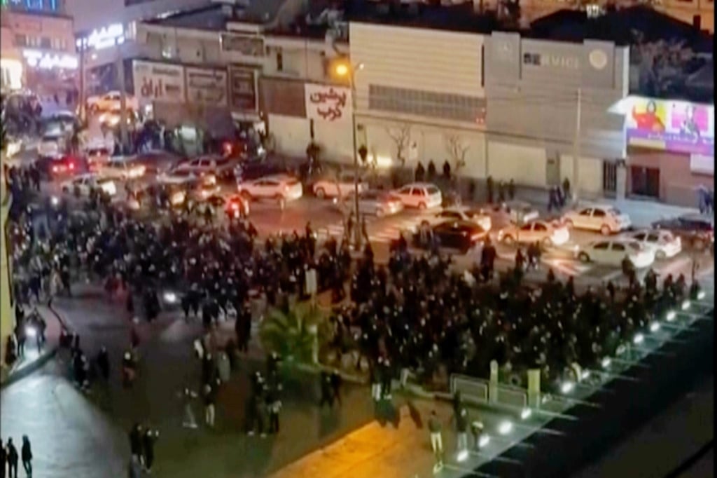 A video screengrab shows people blocking an intersection during a protest in Tehran, Iran, on Thursday. Photo: UGC via AP