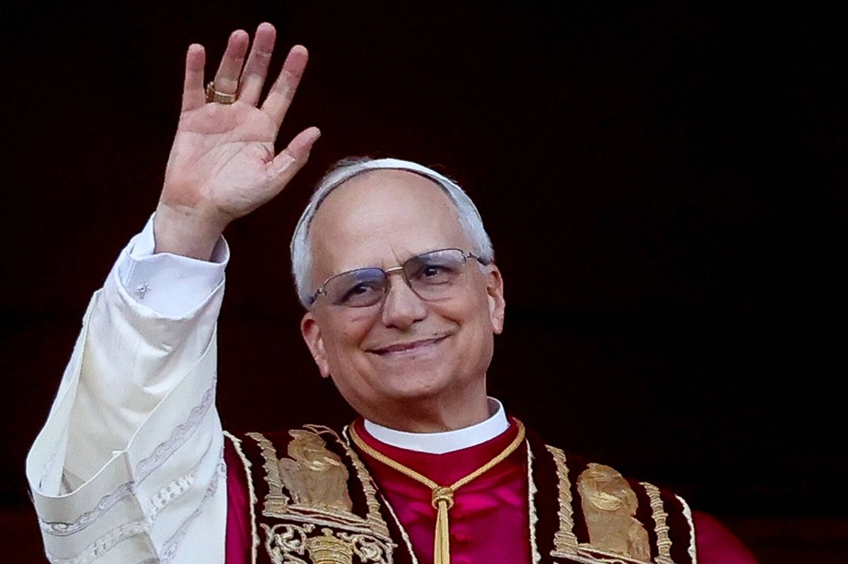 VATICAN CITY, VATICAN - MAY 08: Newly elected Pope Leo XIV, Cardinal Robert Francis Prevost, greets the faithful as he appears from the Central Loggia of St. Peter's Square on May 08, 2025 in Vatican City, Vatican. Cardinals of the Catholic Church have descended on Vatican City to commence the papal conclave, the secretive voting process held in the Sistine Chapel that requires a two-thirds majority to elect the new leader of the Catholic Church. The election follows the death of Pope Francis on April 21 at the age of 88. (Photo by Alessandra Benedetti - Corbis/Corbis via Getty Images)
