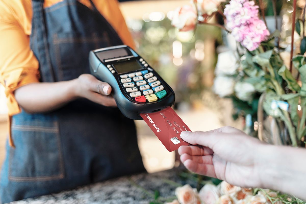 Hands of Flower Shop Visitor making a contactless card payment