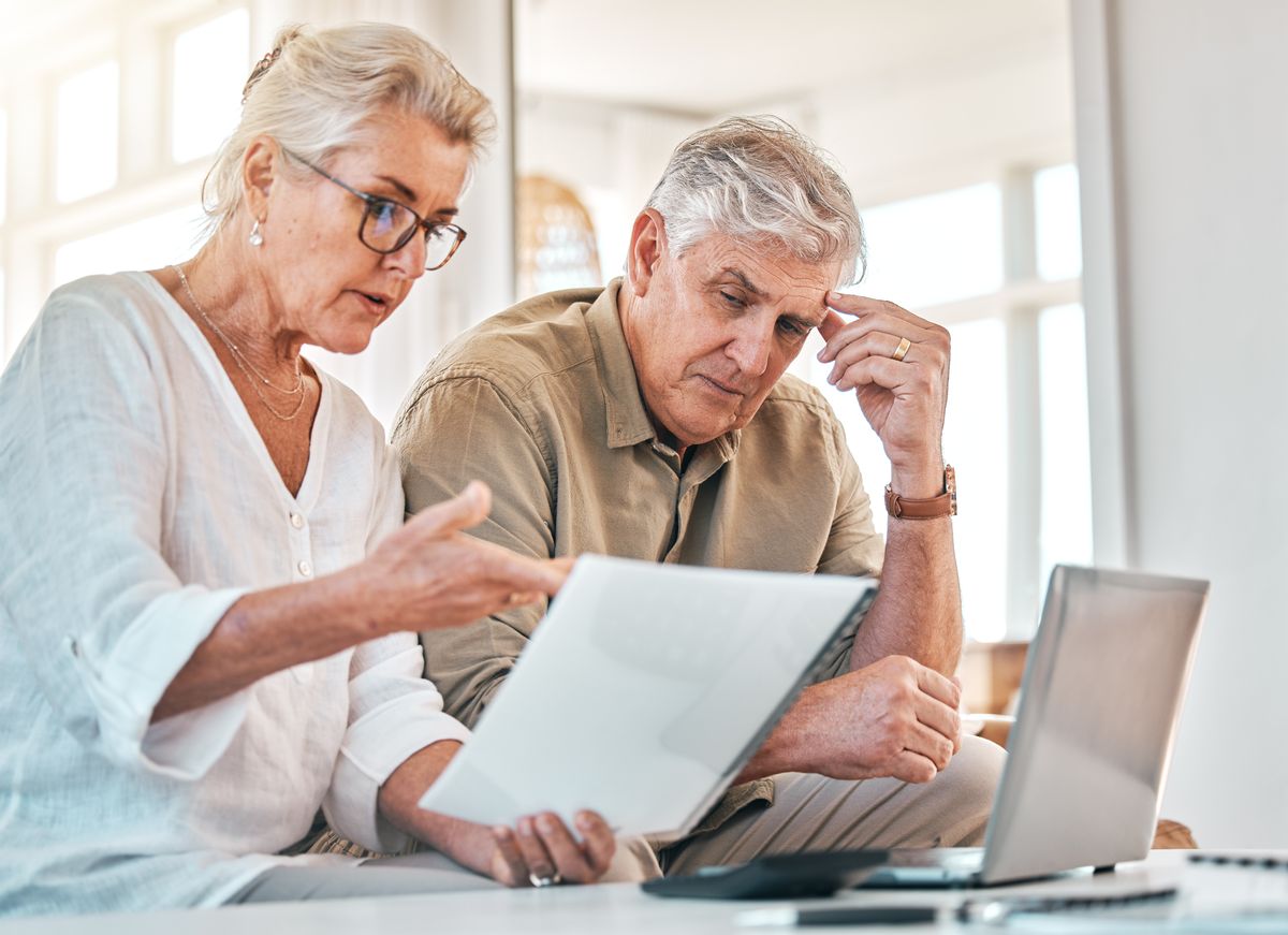 Senior couple going through finances