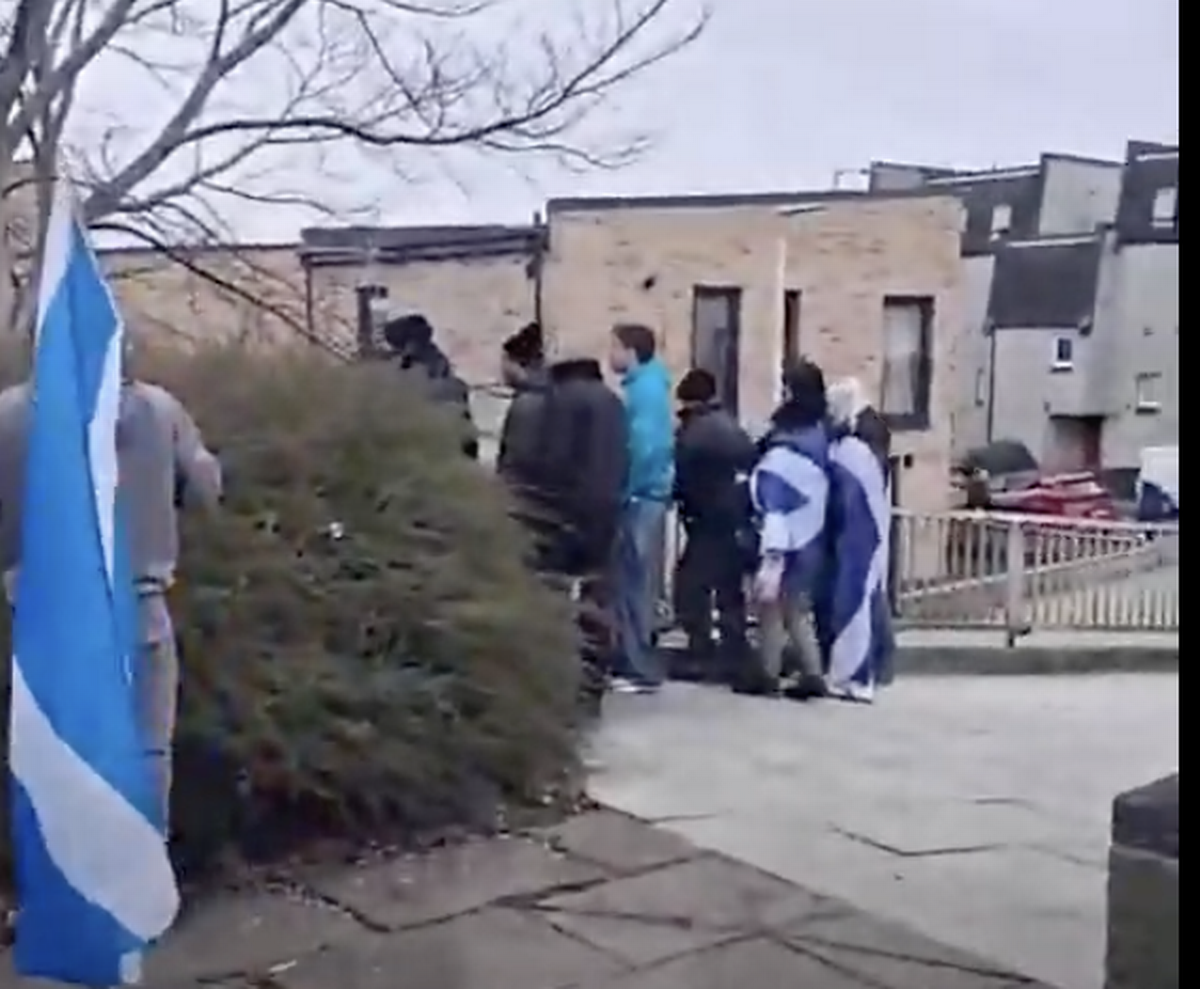 The group were captured on video chanting "paedo protector" at local residents