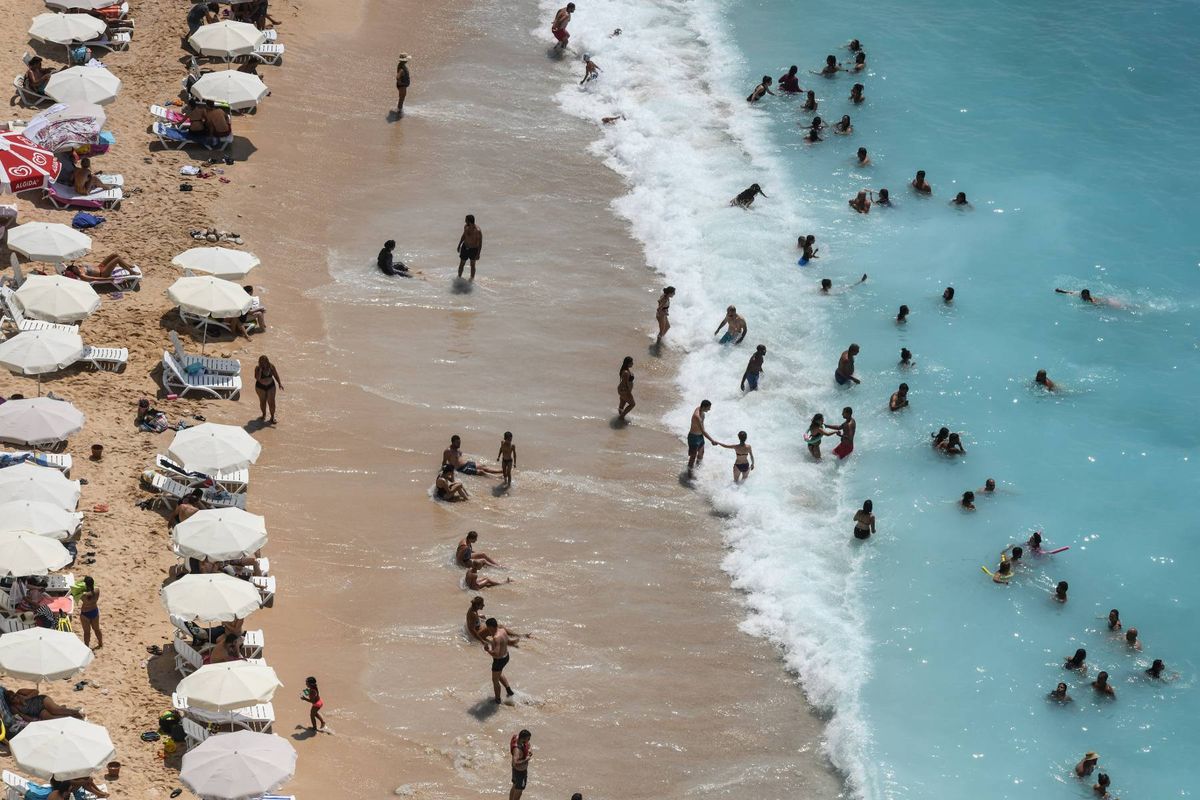 Holidaymakers enjoying the beach in Kas, Turkey