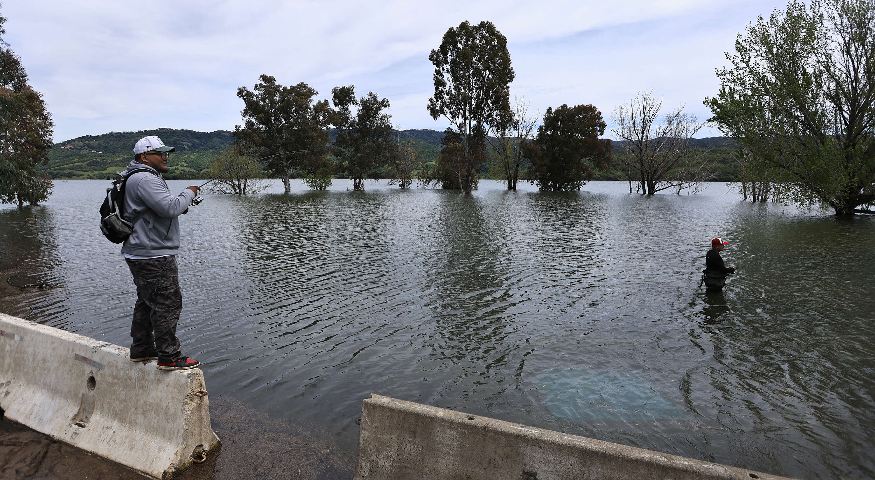 Santa Rosa residents Andy Thongdy, left, and Kevin Vich fish...