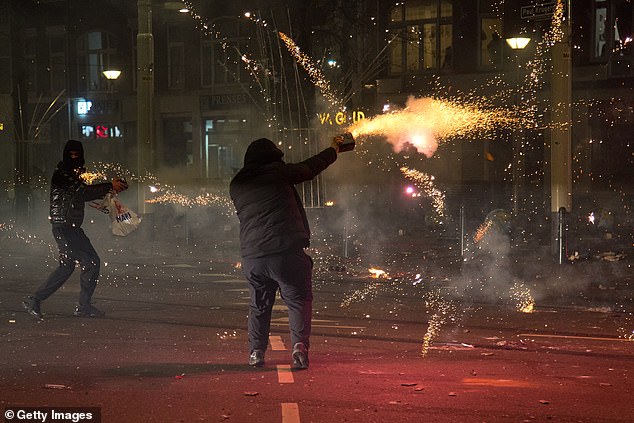 Groups of residents from neighboring streets clash using fireworks
