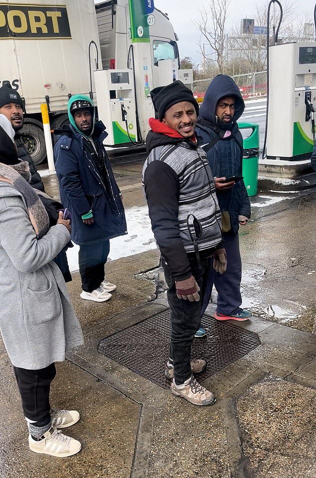 Footage shows a group of migrants wandering through Toddington Services on the M1 in Bedfordshire on Tuesday afternoon, after allegedly getting off a lorry from France
