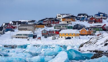 Colorful houses line the snowy coast of Nuuk, the capital city of Greenland. The city has a population of around 20,000