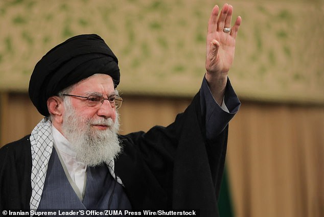 Iranian Supreme Leader Ali Khamenei waves during a gathering of the people of Qom in Tehran. On January 8, 2026