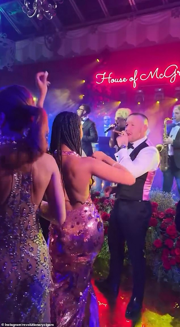 The ex-MMA fighter could be seen enjoying a cigar on the dancefloor during his wedding party
