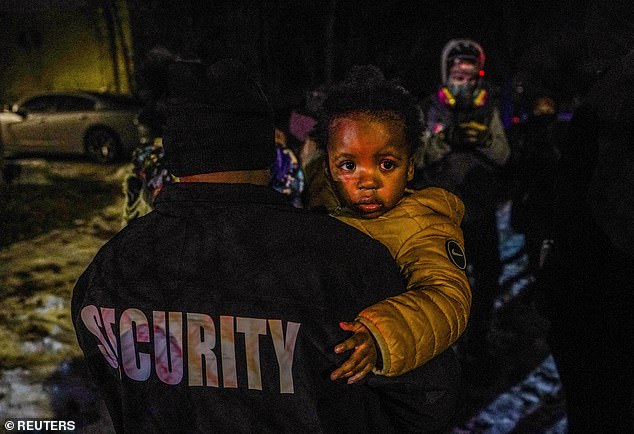 A child was pictured at the scene after tear gas was deployed on protesters