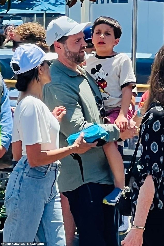 Vice President JD Vance and his wife Usha are all smiles as they enjoy the sights and sounds of Disneyland with their family in Anaheim last July. Federal prosecutors allege the threats against Vance were posted on  Disney's Instagram page
