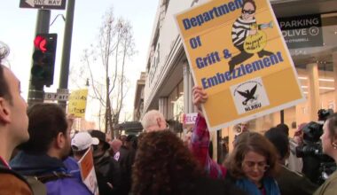 Federal workers protest outside Tesla showroom in San Francisco; Musk defends cuts