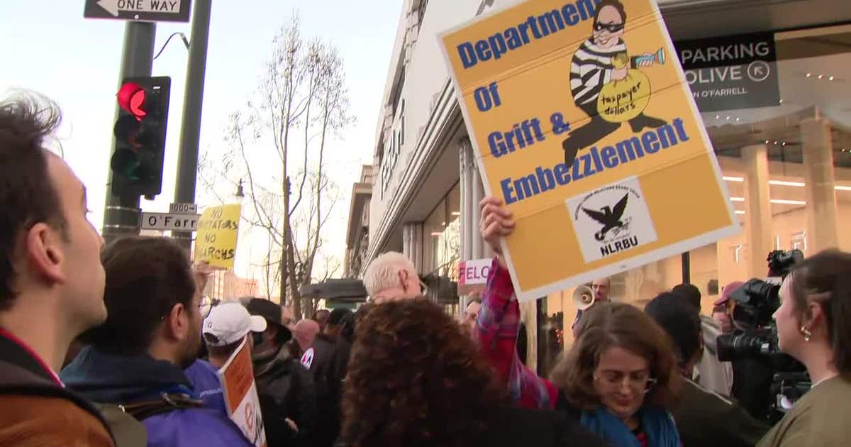Federal workers protest outside Tesla showroom in San Francisco; Musk defends cuts