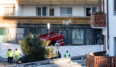 Police officers inspect the area where a fire broke out at the Le Constellation bar and lounge leaving people dead and injured, during New Year’s celebration, in Crans-Montana, Swiss Alps, Switzerland, Thursday, Jan. 1, 2026. (Alessandro della Valle/Keystone via AP)