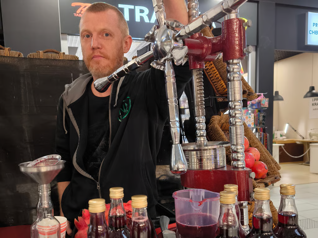 Siarhei Melianets at work pressing pomegranate juice in Warsaw, Poland. Photo: Siarhei Melianets