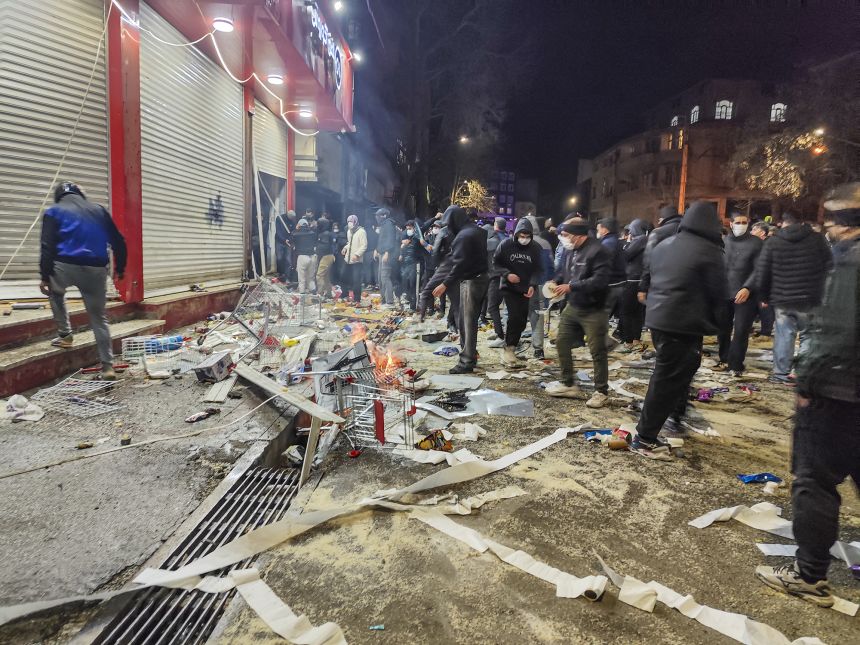 Protesters block a street during a protest in Kermanshah, Iran, on Thursday.