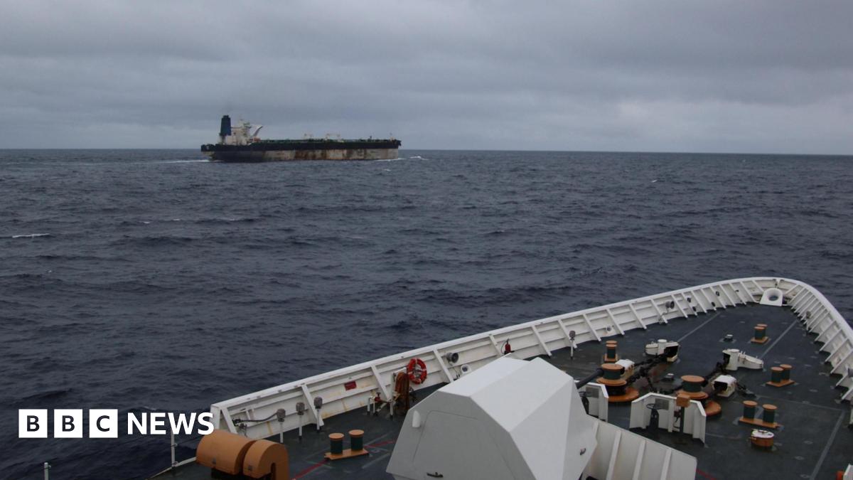 The shadow fleet ship Marinera seen in the distance from the upper decks of a US coastguard cutter following her.