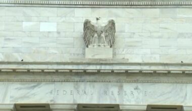 Wall Street falls with financials hit amid credit card rate plan