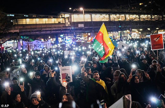 Protesters participate in a demonstration in support of the nationwide mass protests in Iran against the government, in Berlin, Germany, Wednesday, Jan. 14, 2026. (AP Photo/Ebrahim Noroozi)