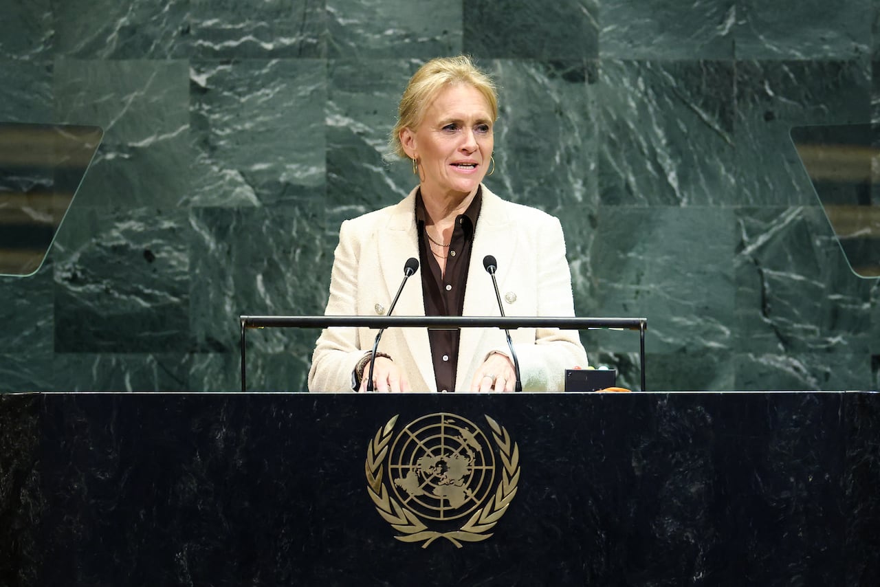 A woman speaks at a podium.
