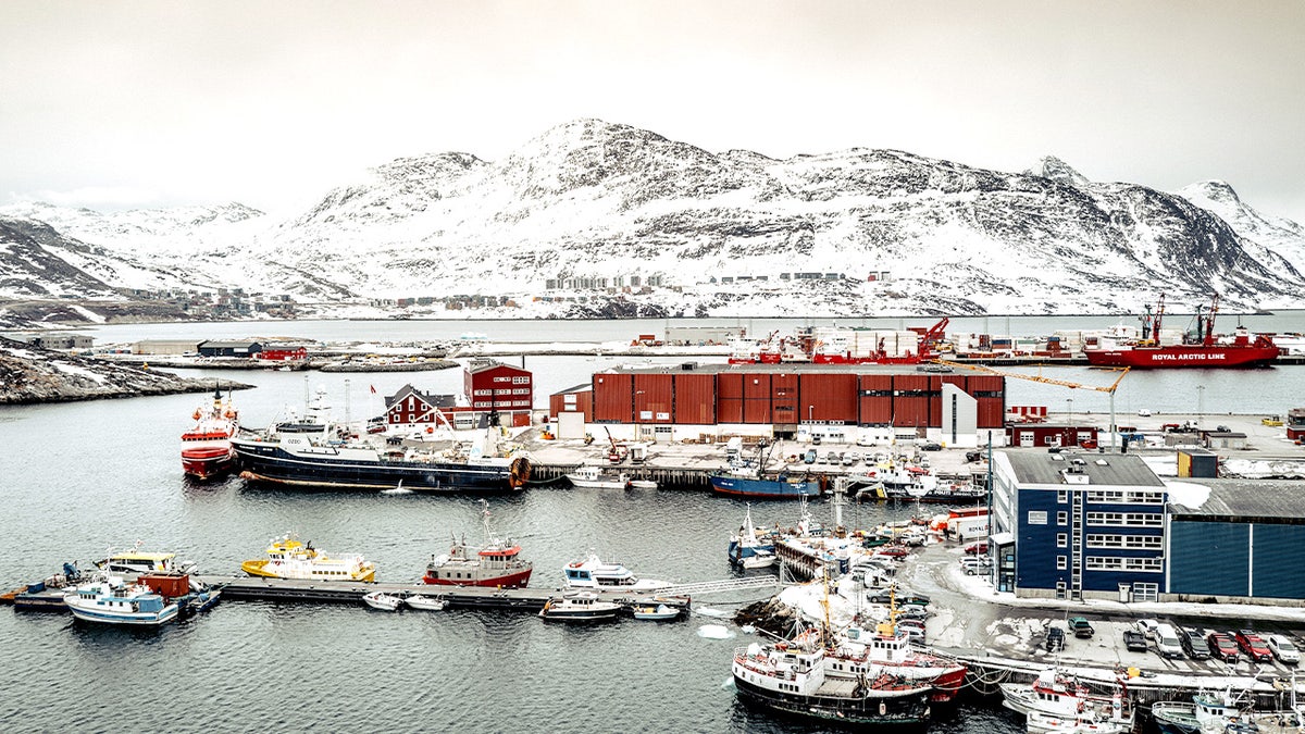 Greenland's landscape and fishing boats.