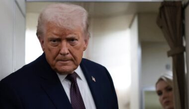 A man in a suit on a plane.