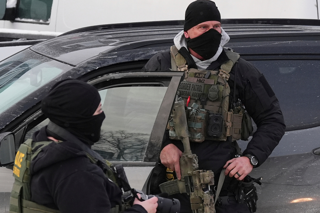 Federal and state officials both claim moral high ground in immigration crackdown after shooting