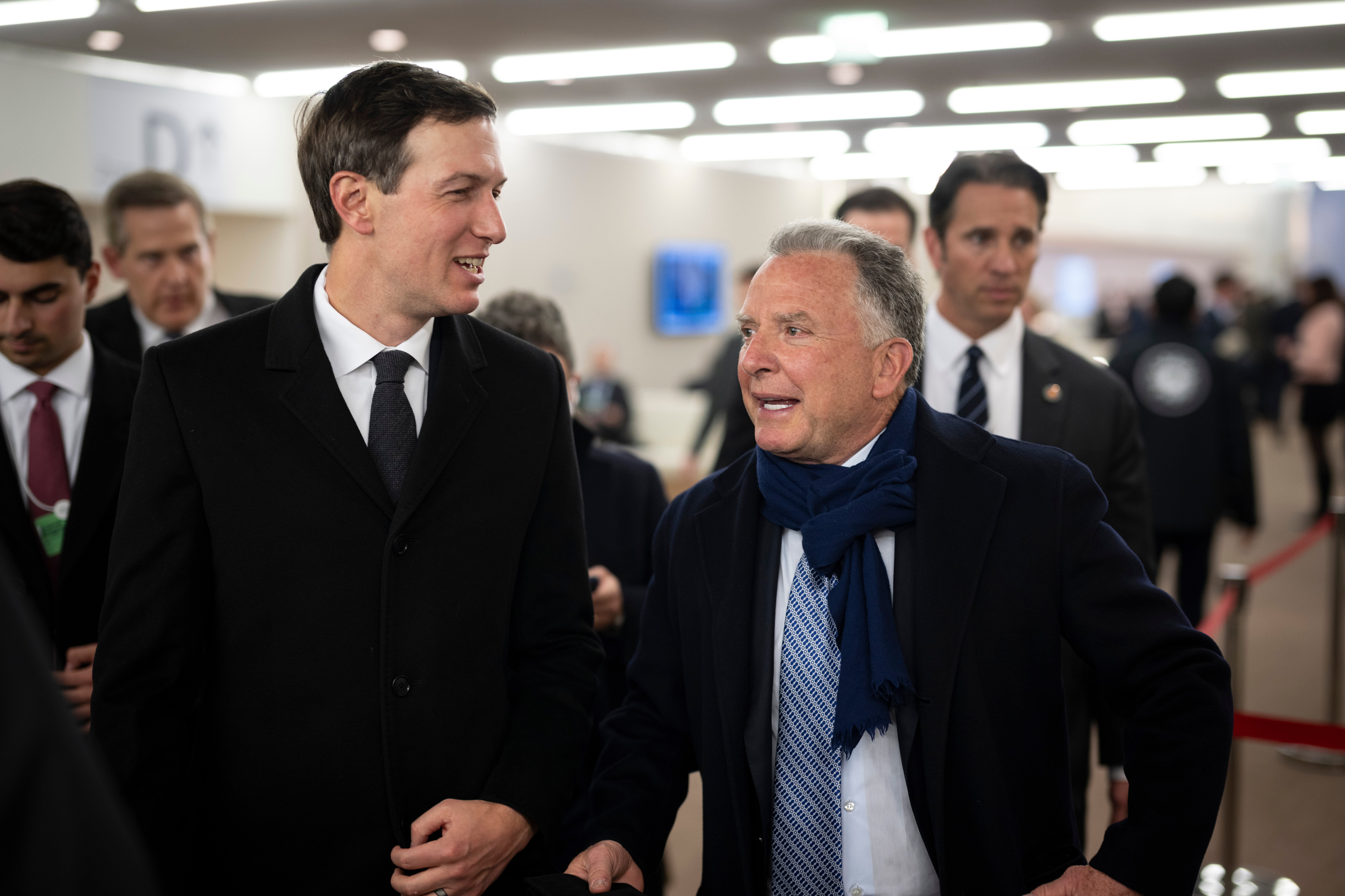 Jared Kushner, left, and Steve Witkoff walk in the corridors during the 56th annual meeting of the World Economic Forum, WEF, in Davos