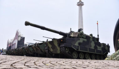 A Harimau medium tank (front), made by state-owned land weapons and ammunition maker PT Pindad, is parked next to Pandur II 8x8 armored combat vehicle against the backdrop of the National Monument (Monas) at Merdeka Square in Central Jakarta on Oct. 2, 2024, ahead of an event to mark the 79th anniversary of the Indonesian Military (TNI).