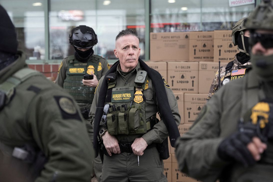 Bovino stands with members of his convoy at a gas station in Columbia Heights, Minnesota, on January 13, 2026 -- less than a week after an ICE agent fatally shot Renee Nicole Good in Minneapolis.