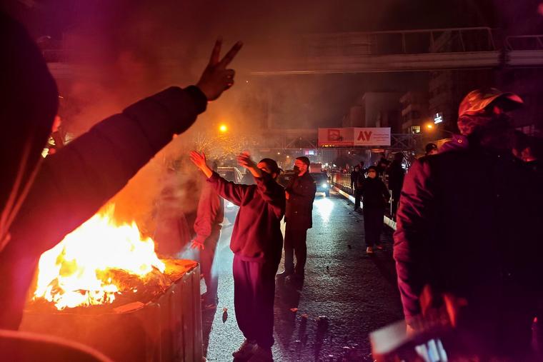 Fires are lit as protesters rally on Jan. 8 in Tehran, Iran. Demonstrations have been ongoing since December, triggered by soaring inflation and the collapse of the rial, and have expanded into broader demands for political change.