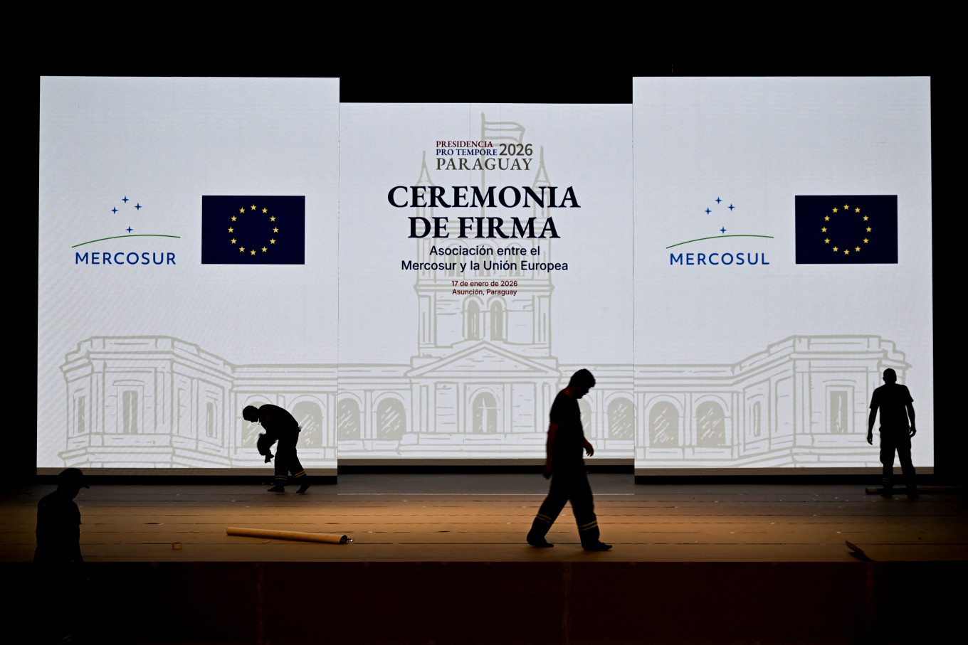 Workers set up the stage for the signing ceremony of the agreement between the European Union and Mercosur at the Gran Teatro Jose Asuncion Flores of Paraguay's Central Bank in Asuncion on January 16, 2026. The South American bloc Mercosur and the European Union will sign a deal on Jan. 17, 2026, 25 years in the making, to create one of the world's biggest free trade areas at a time of growing protectionism and volatility.