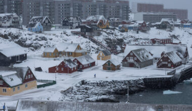 Frozen gambit: A man walks a dog in this aerial photo from Jan. 18, 2026 of Nuuk&rsquo;s old harbor in Greenland. In escalated efforts to acquire Greenland, United States President Donald Trump had threatened tariffs of up to 25 percent on several European countries.