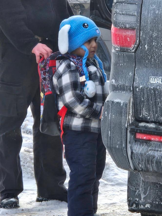 This photo obtained on January 23, 2026, courtesy of Columbia Heights Public Schools, shows an ICE agent holding onto the backpack of a five-year-old student at Valley View Elementary, Liam Conejo Ramos, as he is being detained on January 20, 2026 in Minneapolis, Minnesota.
