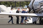 FILE - Harjinder Singh is escorted onto an airplane by Florida Lt. Gov. Jay Collins and law enforcement on Thursday, Aug. 21, 2025, in Stockton, Calif.