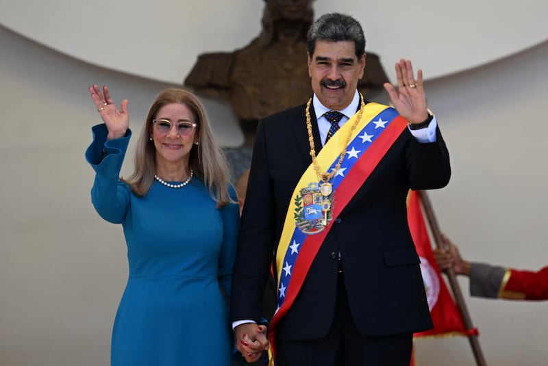 Venezuela's President Nicolas Maduro and his wife Cilia Flores—Trump said the couple have been “captured” and flown out of Venezuela.