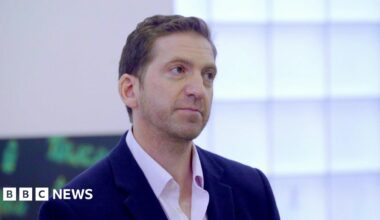 Image is from drone footage of Queensland Place in Liverpool. It is a five-storey block of student accommodation, with two central buildings and wings on other side, surrounded by private residential accommodation, mainly bungalows.