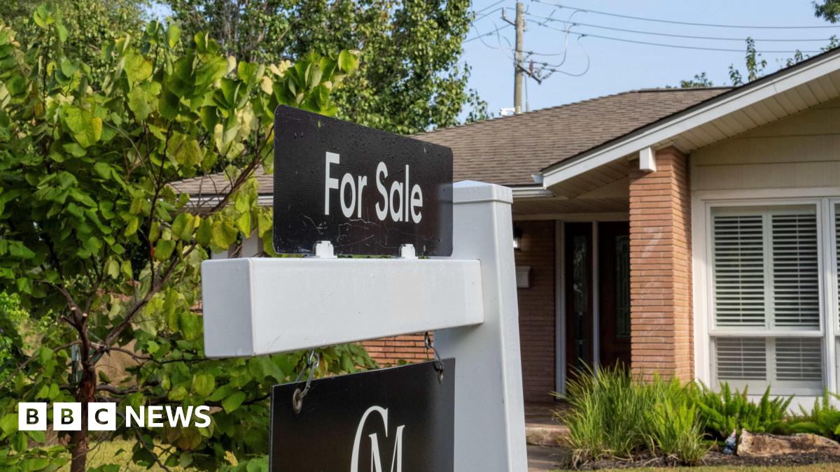 A for sale sign is seen in front of a house.