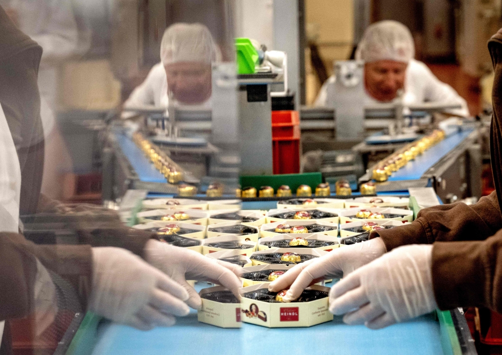 Employees of chocolate maker Heindl, one of the producers of Mozartkugel (Mozart balls) chocolates, work at the Heindl plant in Vienna, Austria. India and the European Union announced on January 27, 2026 the ‘mother of all deals’, a huge trade pact to create a market of two billion people, reached after two decades of negotiations. — AFP pic