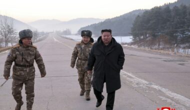 This picture released by North Korea's official Korean Central News Agency (KCNA) shows North Korean leader Kim Jong Un (R) inspecting a missile launch exercise in Pyongyang