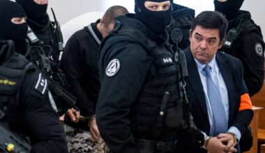 (FILES) Slovak businessman Marian Kocner, suspected of ordering the 2018 assassination of investigative journalist Jan Kuciak and his fiancee Martina Kusnirova (R) and defendant Miroslav Marcek (3rdR) are escorted into the courtroom for the start of their trial at the Judicial Academy building in Pezinok, Slovakia, on December 19, 2019. The alleged mastermind of a Slovak investigative journalist's murder is due to stand another retrial on Monday, eight years after the crime rocked the central European country. — AFP
